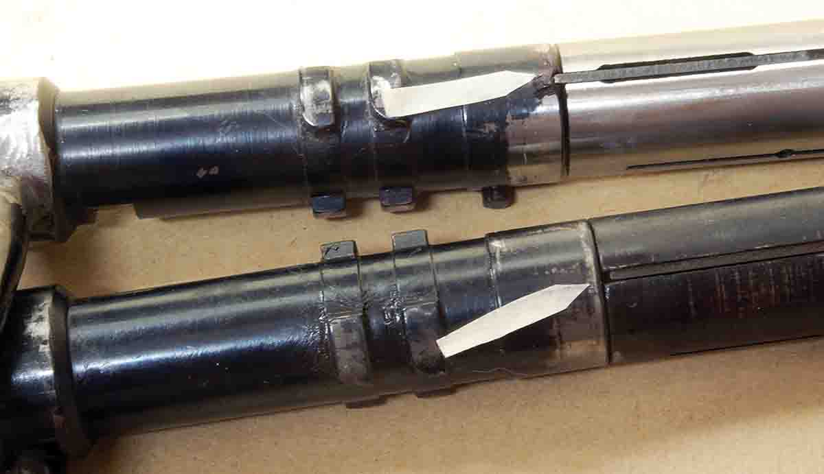 The arrow on the Model 541 target rifle (top) shows the firing-pin extension that engages the rear half of the bolt body, preventing misalignment when reinstalling the bolt in the receiver. Models 580, 581 and 582 don’t have this desirable feature for some reason.